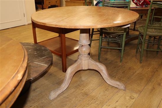 An early 19th century pine tea table